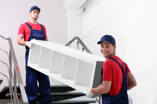 Careful loading of household items into a removals van