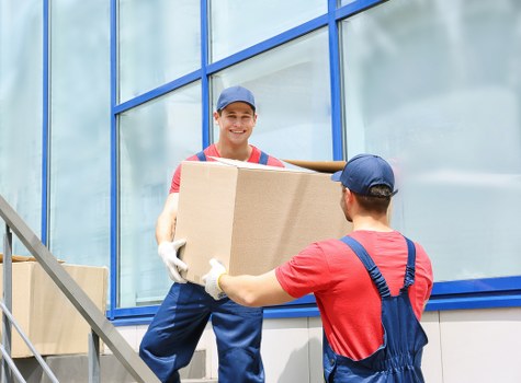 Packed student belongings being organised for transport and storage