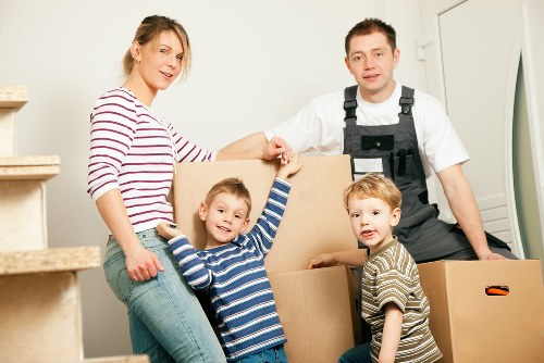 Local removals team navigating stairs in a Northwood flat move
