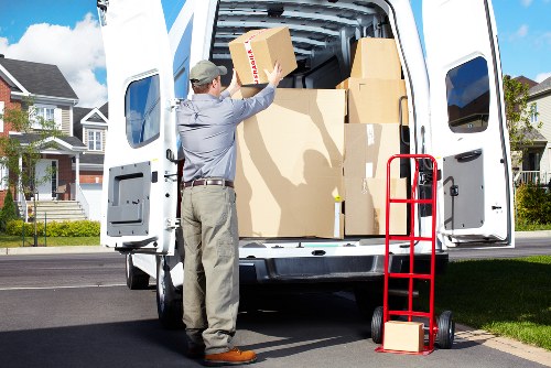 Van loading a sofa and boxes for a Northwood collection