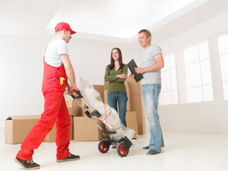 Professional movers transporting boxes and furniture in Northwood