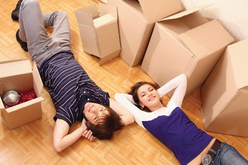 Local office movers loading business items carefully